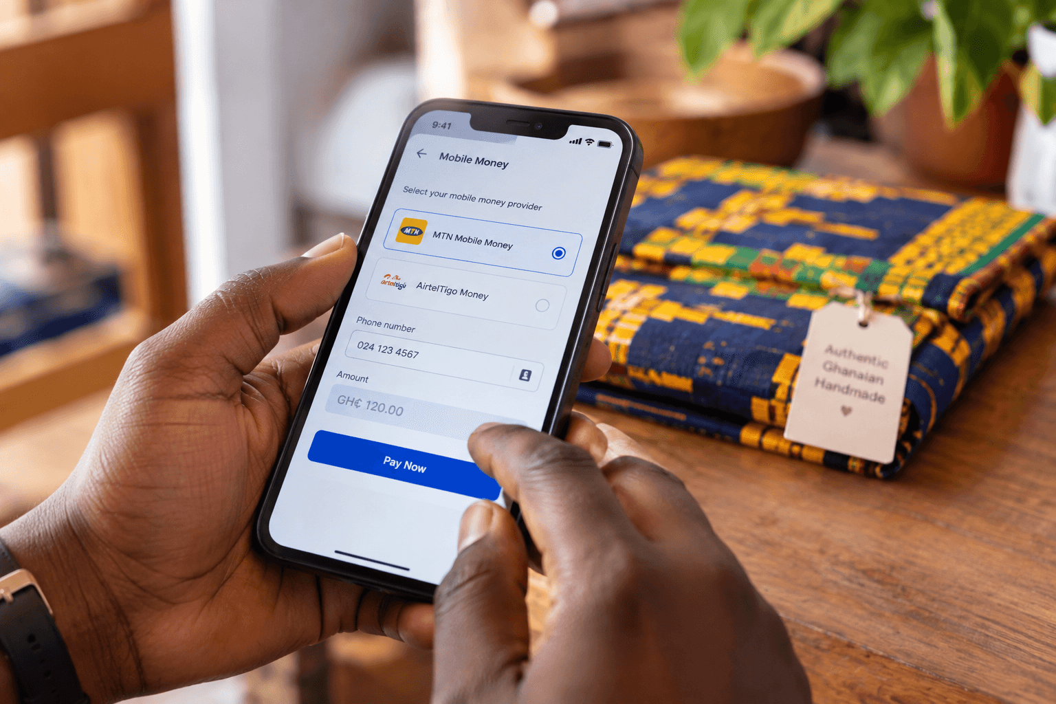 A customer paying for an order with MTN Mobile Money on their phone